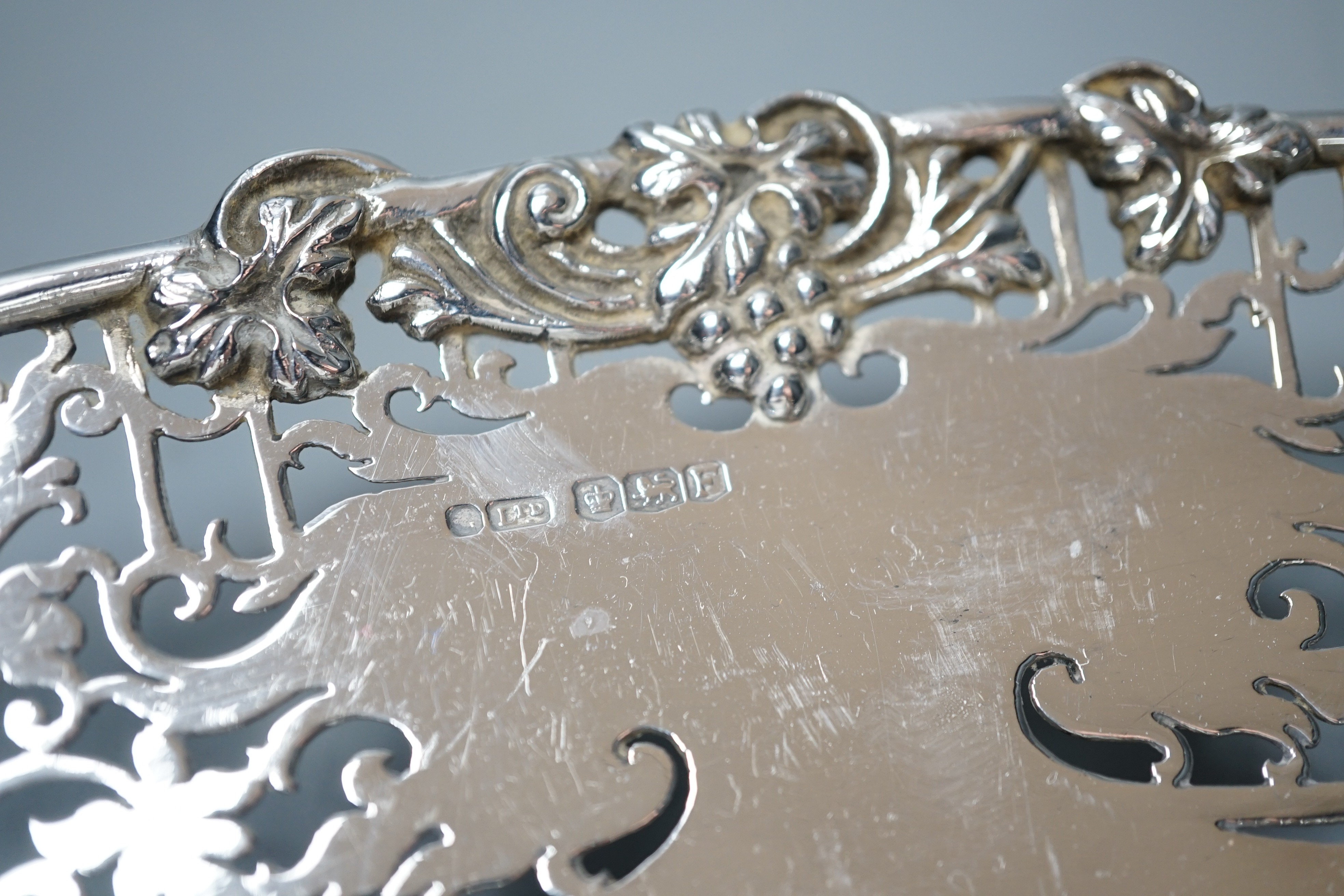 A George VI pierced silver shallow dish, Sheffield, 1948, 30cm, 19oz.